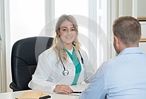 Doctor and patient at clinic office in medical consultation