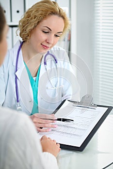 Doctor and patient, close-up of hands. Physician talking about medical examination results. Medicine, healthcare an