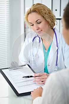 Doctor and patient, close-up of hands. Physician talking about medical examination results. Medicine, healthcare an