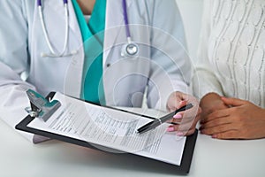 Doctor and patient, close-up of hands. Physician talking about medical examination results. Medicine, healthcare an