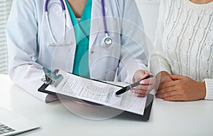 Doctor and patient, close-up of hands. Physician talking about medical examination results. Medicine, healthcare an