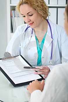 Doctor and patient, close-up of hands. Physician talking about medical examination results. Medicine, healthcare an