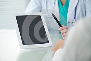 Doctor and patient, close-up of hands. Physician talking about medical examination results. Medicine, healthcare an