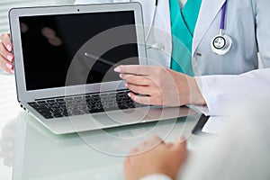 Doctor and patient, close-up of hands. Physician talking about medical examination results. Medicine, healthcare an