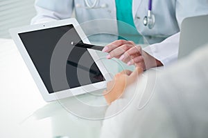 Doctor and patient, close-up of hands. Physician talking about medical examination results. Medicine, healthcare an