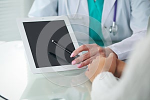 Doctor and patient, close-up of hands. Physician talking about medical examination results. Medicine, healthcare an