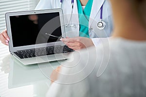 Doctor and patient, close-up of hands. Physician talking about medical examination results. Medicine, healthcare an