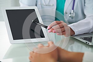 Doctor and patient, close-up of hands. Physician talking about medical examination results. Medicine, healthcare an