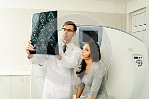 Doctor with patient at computed tomography