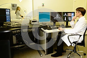 Doctor with patient at the computed tomography photo