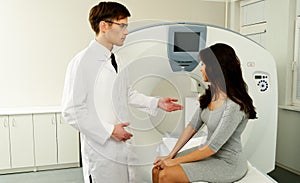 Doctor and patient at computed tomography photo