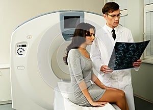 Doctor with patient at the computed tomography