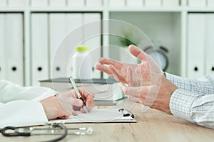 Doctor and patient during consultation in medical office