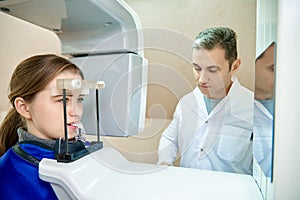 Doctor and patient, dentistry, dental tomograph