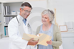 Doctor and patient discussing over reports