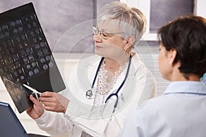 Doctor and patient discussing x-ray results.