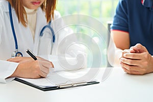 Doctor and patient are discussing something, medical diagnosis c photo