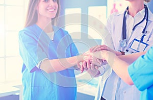 Doctor and patient discussing something while sitting at the table . Medicine and health care concept