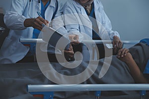 Doctor and patient discussing something while sitting at the table . Medicine and health care concept. Doctor and patient