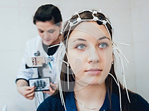 Doctor and patient with encephalography electrode. Electroencephalogram