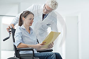 Doctor and patient examining medical records