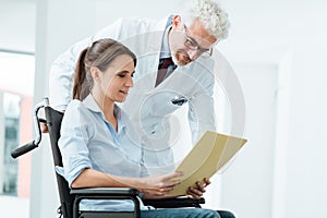 Doctor and patient examining medical records