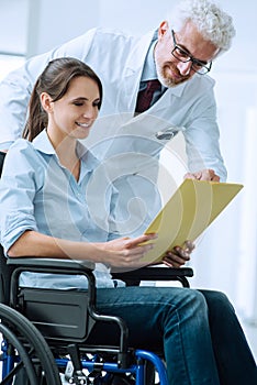 Doctor and patient examining medical records