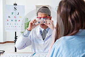 The doctor with patient at eye exam