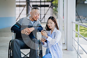 Doctor and patient in medical discussion on digital tablet