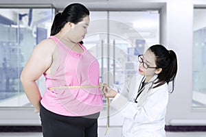 Doctor with a patient obesity in the clinic