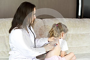 Doctor and patient on preventive examination. Medicine to children