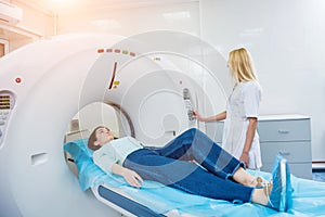 Doctor and patient in the room of computed tomography at hospital