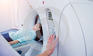 Doctor and patient in the room of computed tomography at hospital