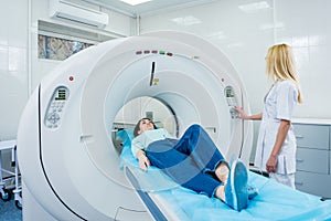 Doctor and patient in the room of computed tomography at hospital