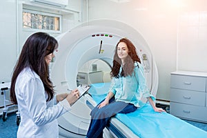 Doctor and patient in the room of computed tomography at hospital