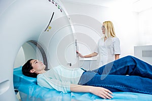 Doctor and patient in the room of computed tomography at hospital