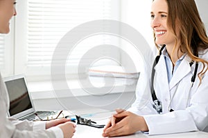 Doctor and patient sitting at the desk