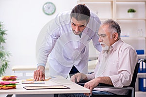 Doctor and patient suffering from Alzheimer disease