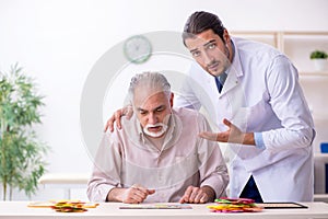 Doctor and patient suffering from Alzheimer disease