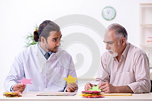 Doctor and patient suffering from Alzheimer disease