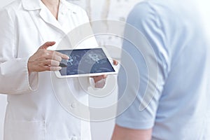 Doctor patient tablet cat scan images photo
