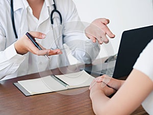 Doctor and Patient are talking in the hospital. Health care and Medical Concept