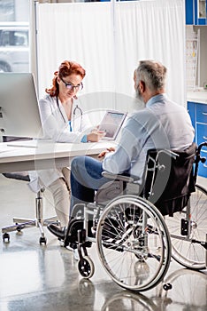 Doctor and patient in wheelchair