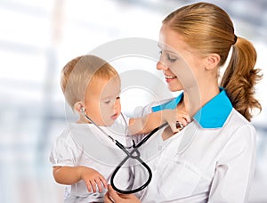 Doctor pediatrician and patient happy child baby