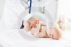 Doctor pediatrician stethoscope listening to baby photo