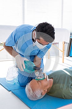 Doctor performing resuscitation on patient