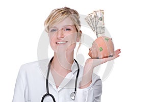 Doctor with piggybank (dollar)