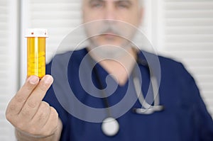 Doctor with pill bottle