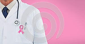 doctor with pink breast cancer awareness 3d ribbon