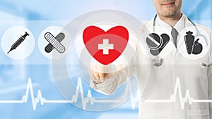 Doctor pointing at heart icon on blue background